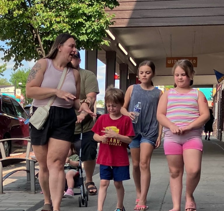 A small boy in tears walking down Broadway in Wisconsin Dells