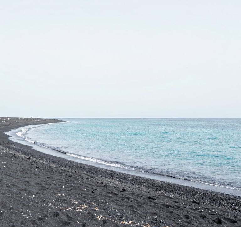 A minimalist landscape of a secluded beach with dark volcanic sand and clear turquoise water. The composition is clean and tranquil, using a palette of soft whites (#F7F9FA) and light blues (#A8C9CF). Very elegant and peaceful mood.