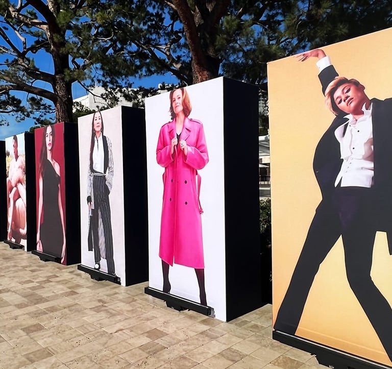 a row of posters of a man in a suit