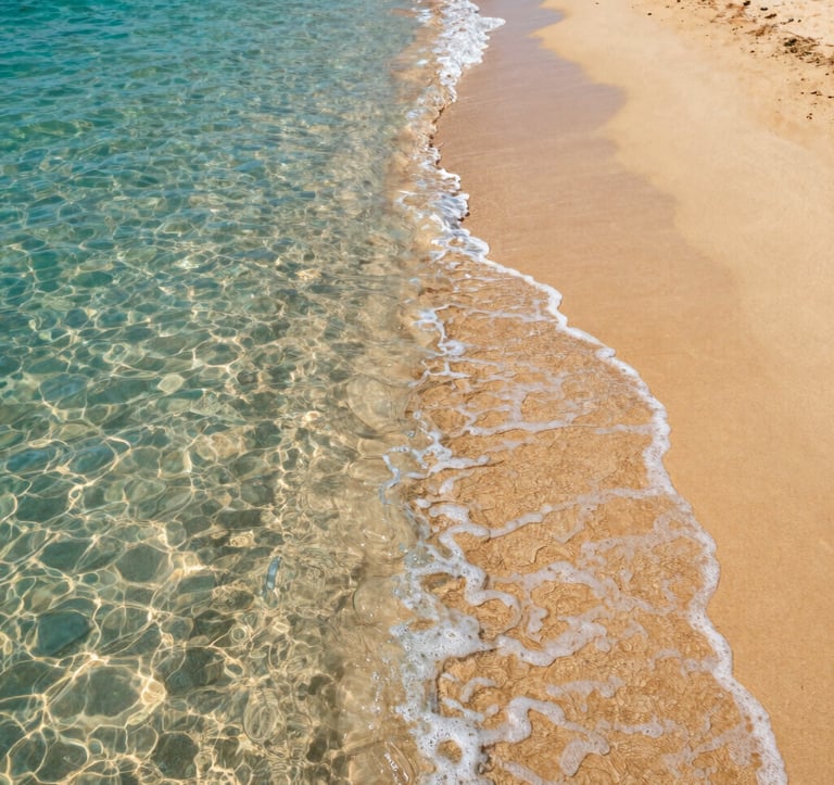 A serene close-up photograph of crystal-clear turquoise water lapping onto a beach of fine golden sand in a North African / Egyptian coastal region. The lighting is bright and warm, highlighting the purity of the environment.