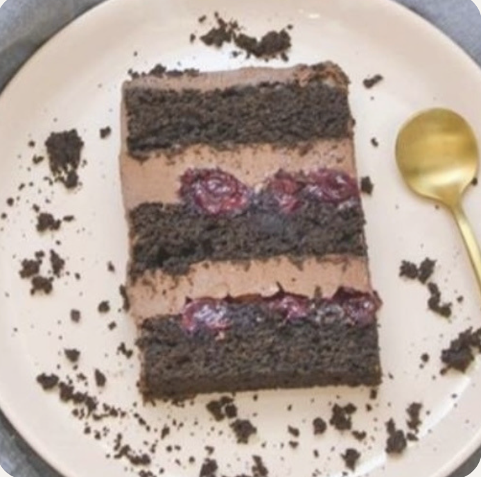 a piece of cake with chocolate frosting on a plate