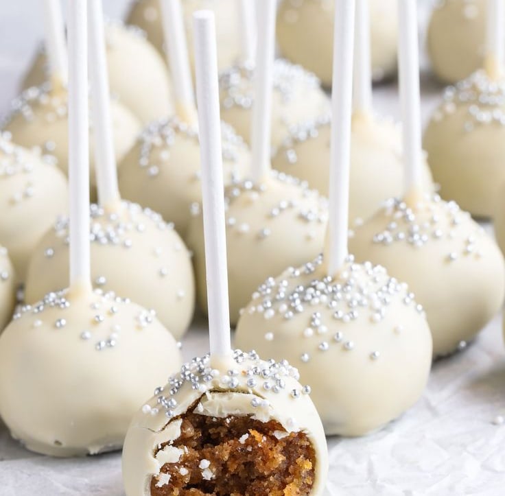 a bunch of cake pops on a table