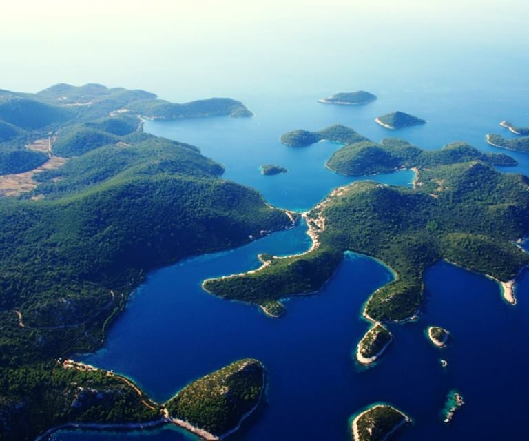 View of Lastovo Archipelago islands with clear blue sea and rocky coastline.