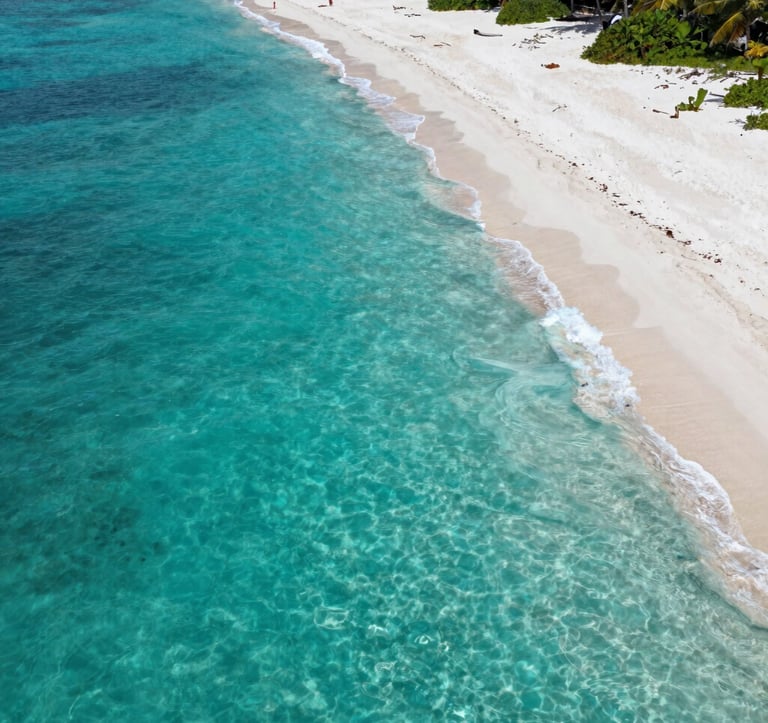 A crisp, high-resolution photo of a secluded turquoise bay with white sand, professional drone perspective, bright natural daylight, conveying a sense of peace and exclusivity, North American / US vacation vibe.