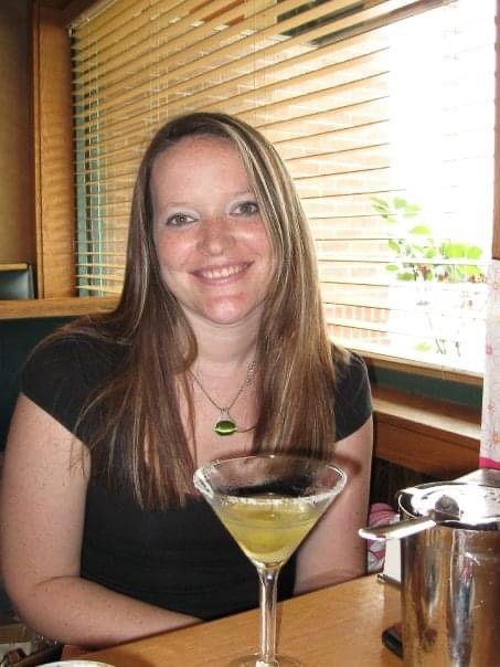 a young women drinking alcohol at restaurant