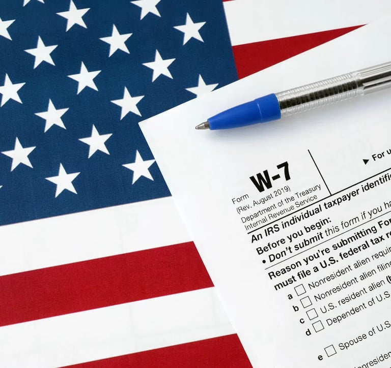 a pen. W-7. Itin number. Taxes. Accounting. ITIN Number in USA