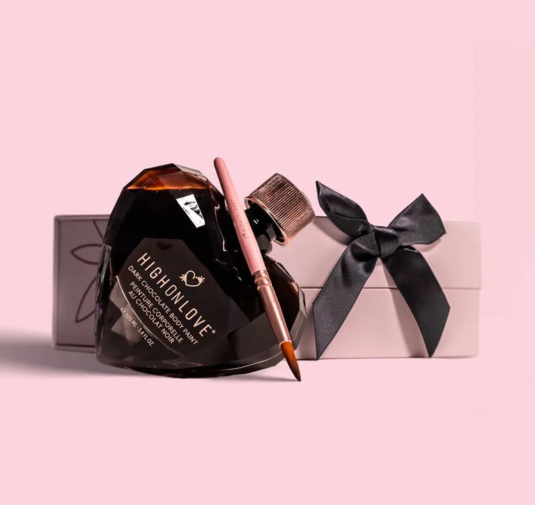 The photo shows a HighOnLove product  - a chocolate body paint, packaged in a crystal glass heart. 
