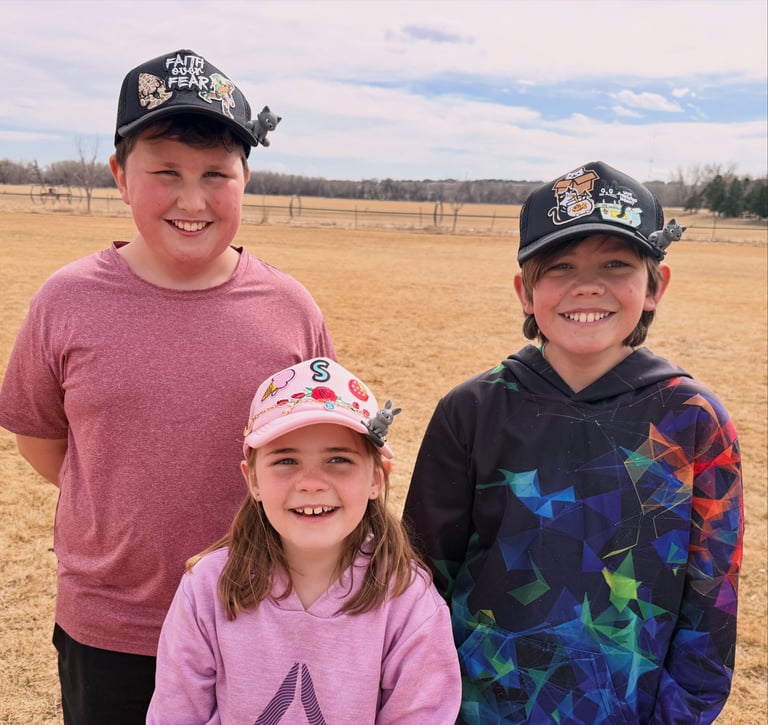 3 kids wearing hats with patches, chains and BrimPets