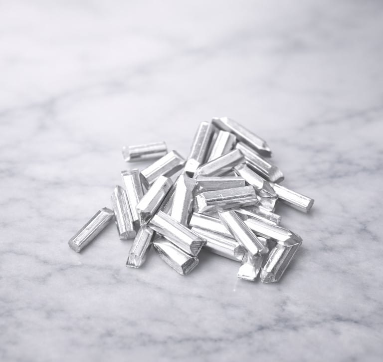Pure silver grain pieces on light marble, showing texture for DIY jewelry making 5 gram
