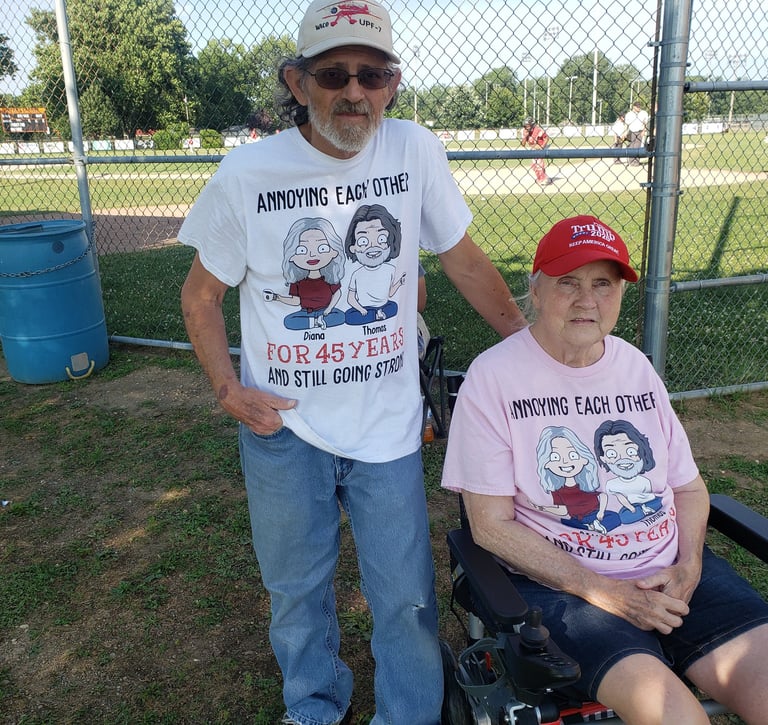 a man and woman in a wheelchair in a baseball game