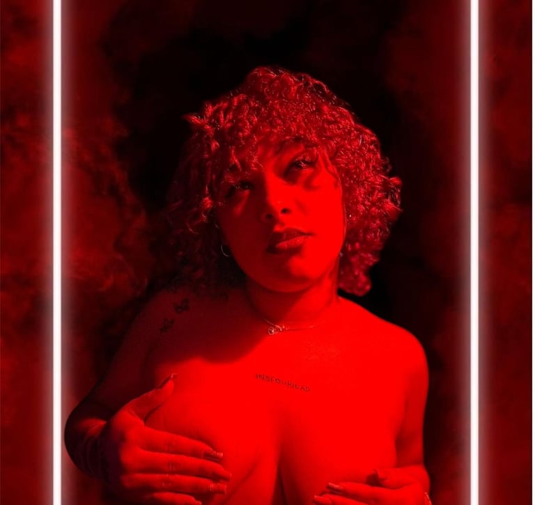 a woman with a red hair and a red light