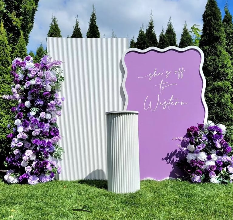Gradualtion party with a purple and white floral theme
