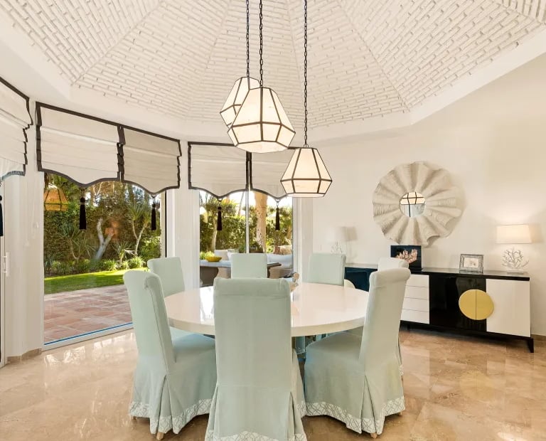Dining space at Villa El Rincon with arched windows
