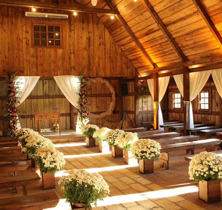 a barn decorated in off whites for a wedding