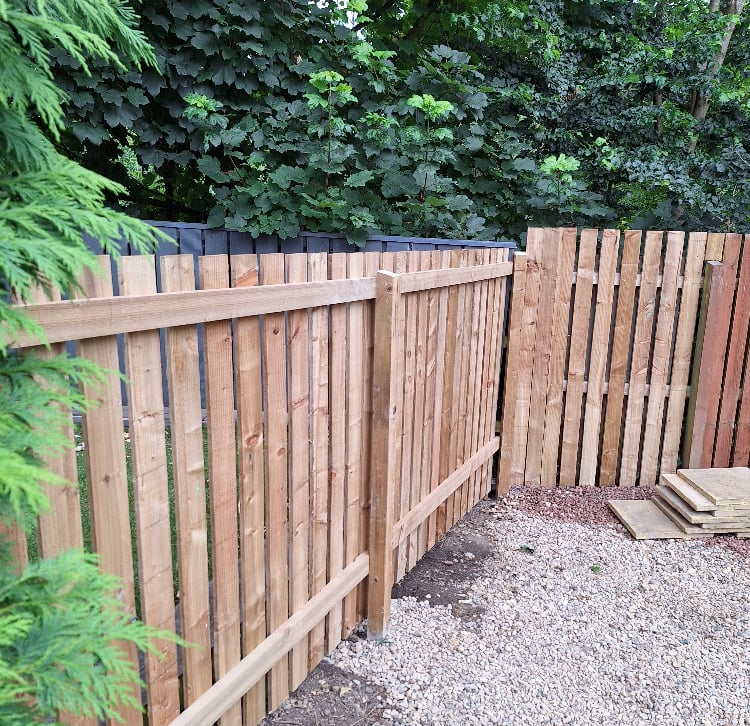 fenced in area with gravel