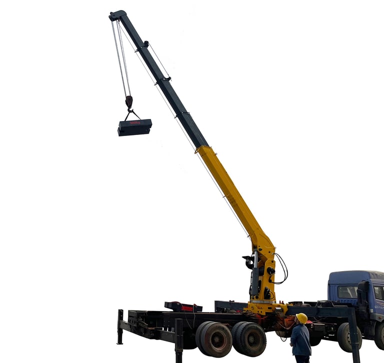 A man standing next to a 10 ton Telescopic Boom Truck Mounted Crane lifting a large object with 5 section arms.