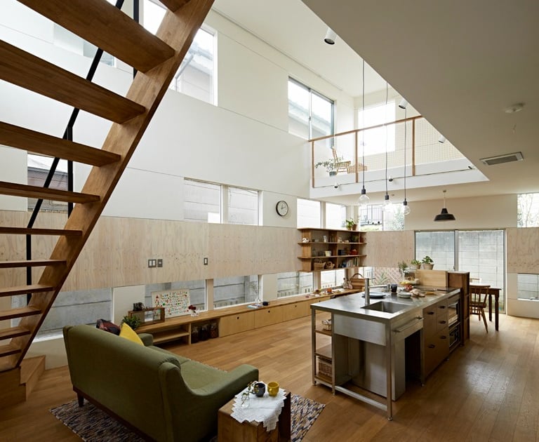 Learn about us: modern home kitchen with stainless steel island, integrated sink.