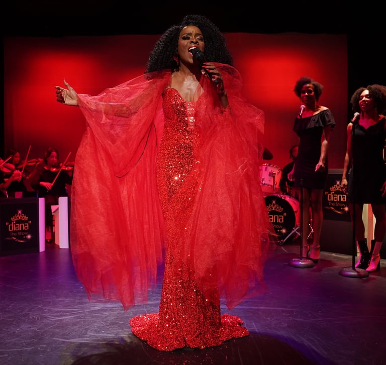 a woman in a red dress and an entire band with backup singers in the background