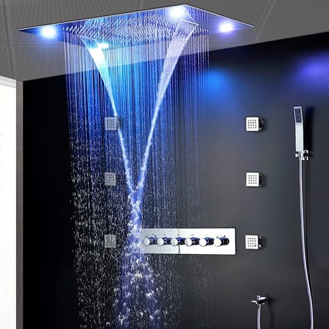 a shower head with a blue light shining down