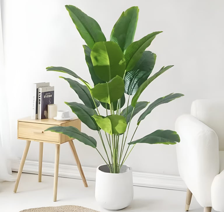 Indoor potted plant placed in a cozy bedroom reading nook for small space home decor inspiration.