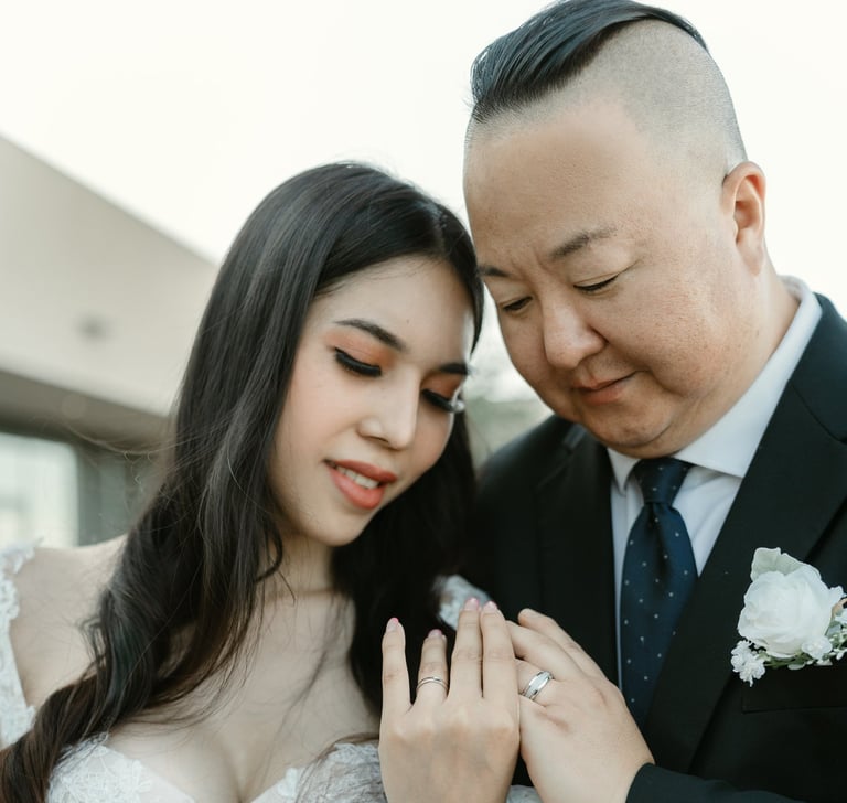couple looking at thier rings