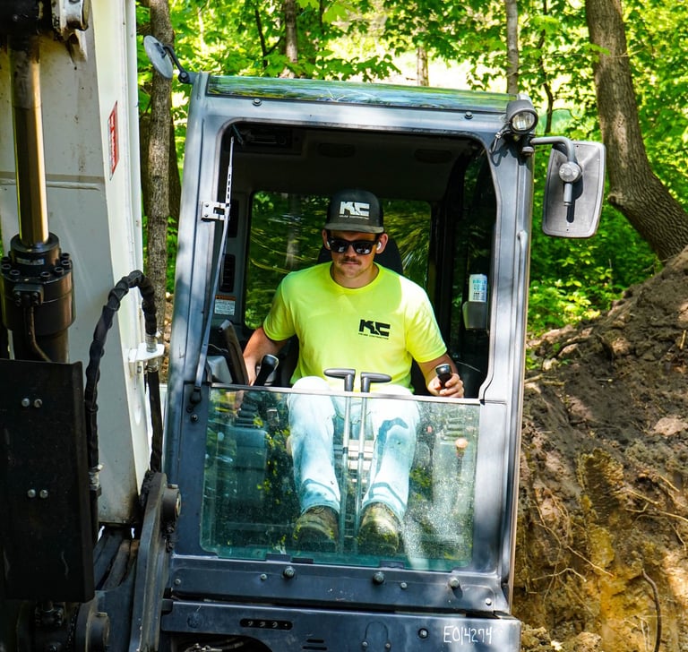 Patrick Kruse, Owner of Kruse Contracting, digging in an excavator