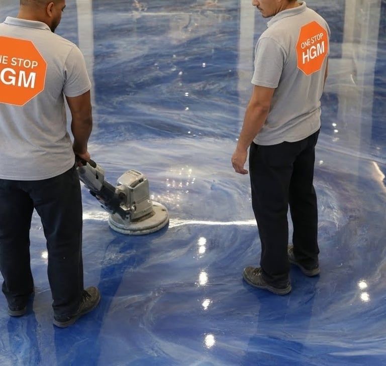 two men in white shirts and blue jeans standing in a room buffing a finished epoxy floor