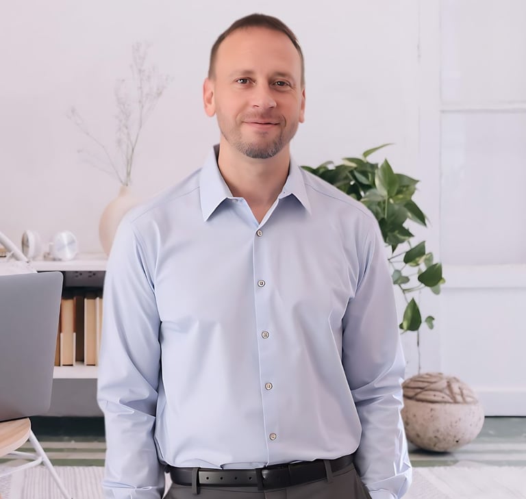 a man in a blue shirt and a laptop