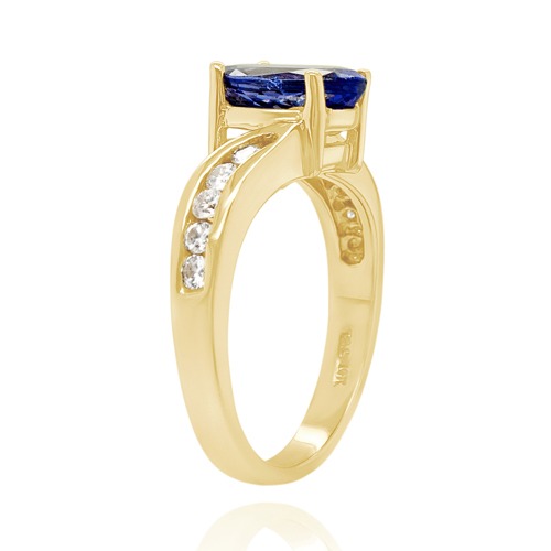 a ring with a blue sapphire and diamond ring