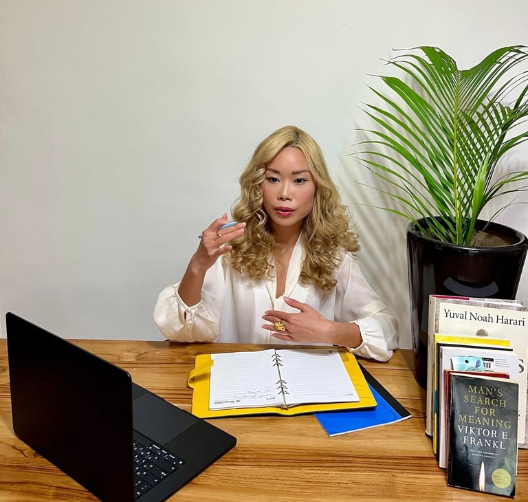 Renee Lin providing one-on-one career coaching at her desk