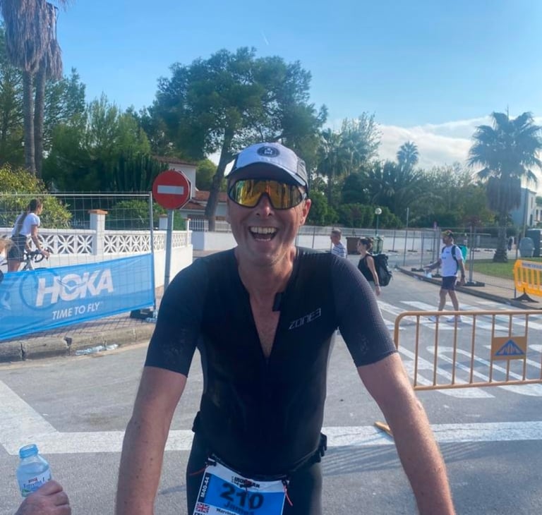 James Oswald Coaching athlete celebrating at Ironman Majorca 