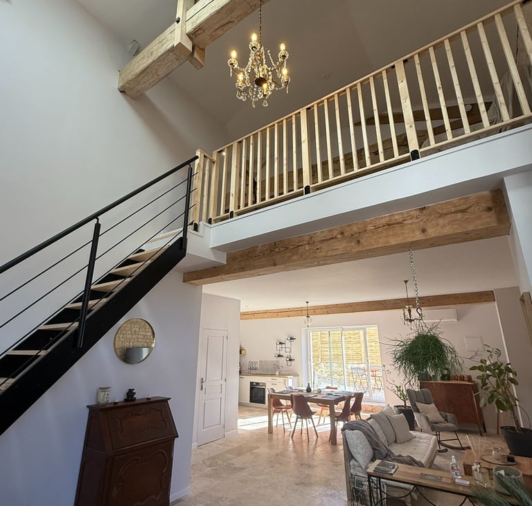 a living room with a staircase and a staircase