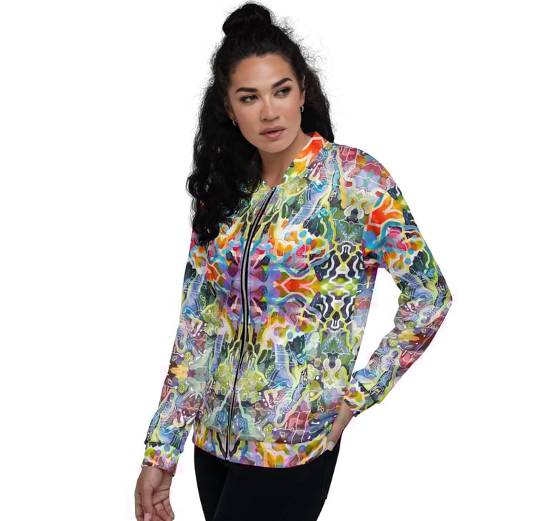 a woman in a colorful jacket and black pants