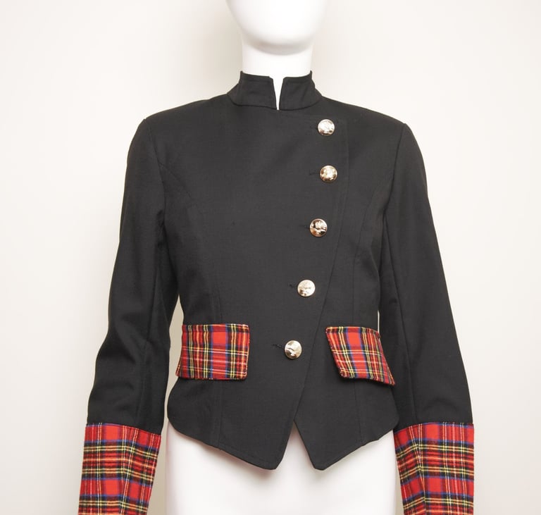 Tartan pocket flaps and cuffs on asymmetric  jacket  fastened in metal military buttons