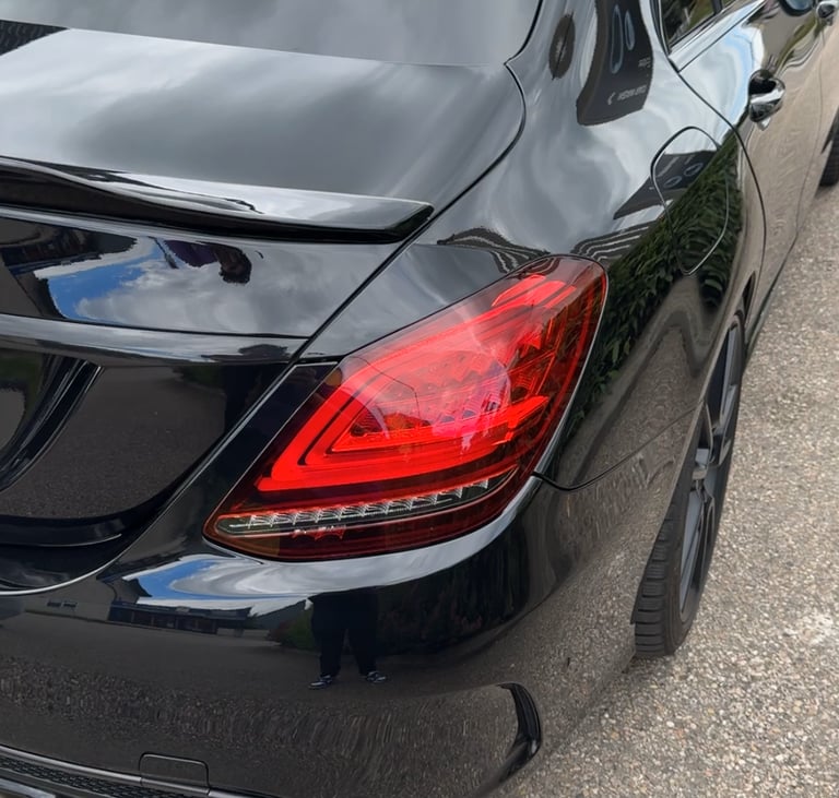 a black car parked in a parking lot