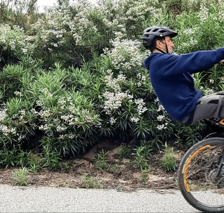 mountain biker in the balance point of seated manual