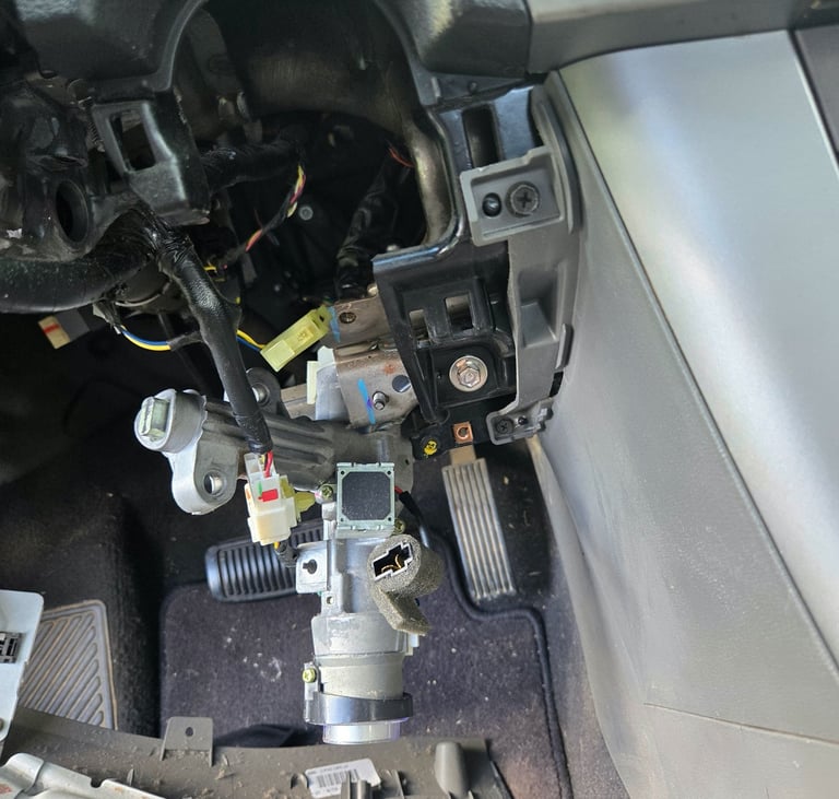 Car ignition lock cylinder repair with steering column trim removed