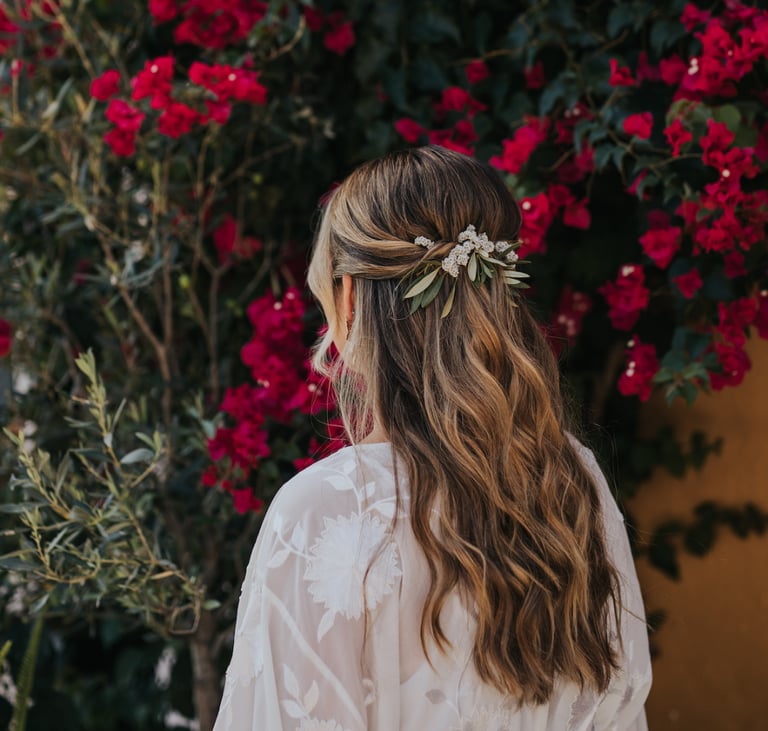Half up half down wedding hairstyle with natural flowers Hugo Coelho Photography