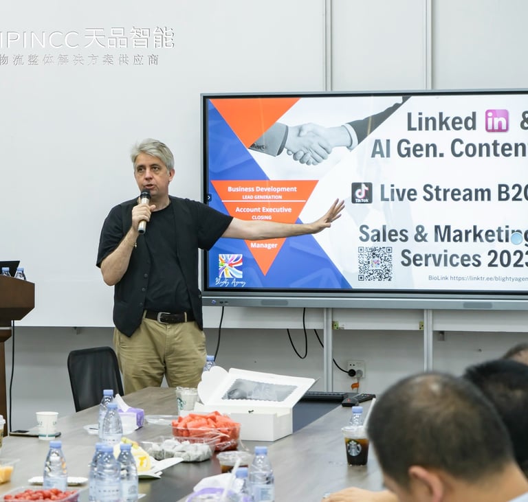 a man standing in front of a large screen