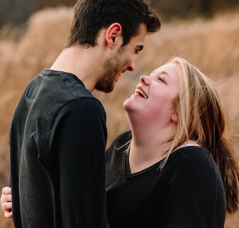 Young couple smiling at each other