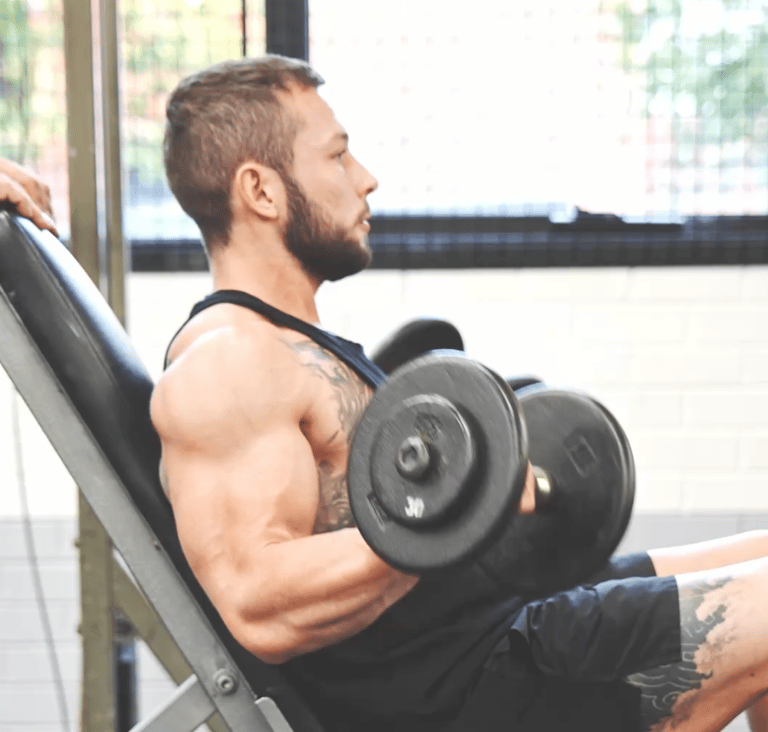 Jackson Demonstrating form and focus on a dumbell curl
