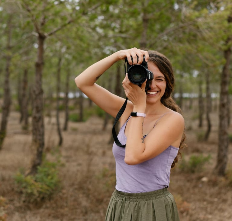 a woman taking a picture of herself taking a picture of herself