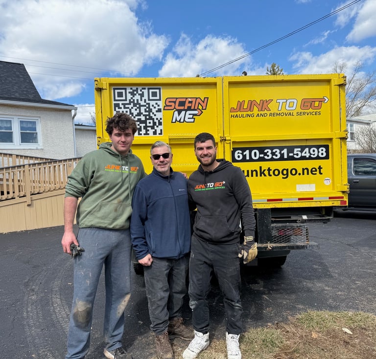 Junk to Go crew with truck in Montgomery County, 610-331-5498.