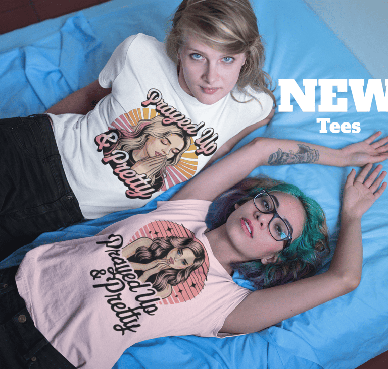 Two women wearing Prayed Up and Pretty graphic t-shirts from a new collection of apparel.