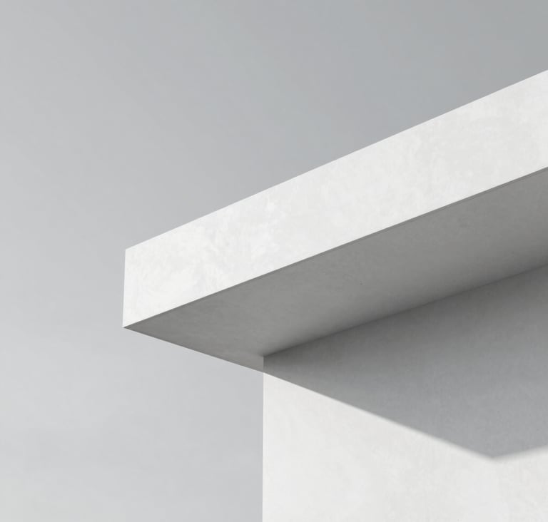 Close-up of a minimalist architectural structure featuring clean, sharp lines of white concrete against a pale gray sky (#D8D8D8). The composition is geometric and balanced, emphasizing luxury and structural precision. No distracting elements, just light and shadow.