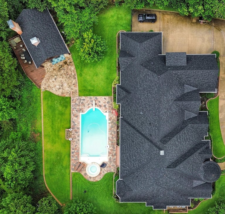 Completed residential roof replacement at a luxury home in Tyler, TX including pool house 