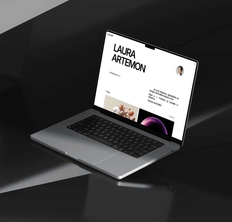 A laptop on a desk displaying the Laura.art website