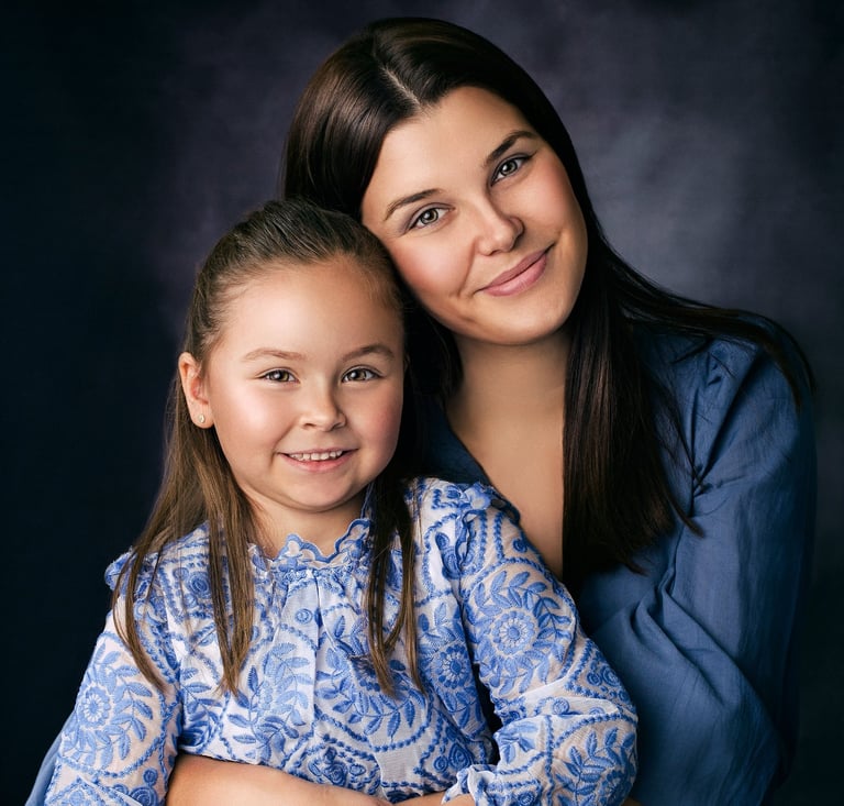 Mother and daughter embracing during a portrait session