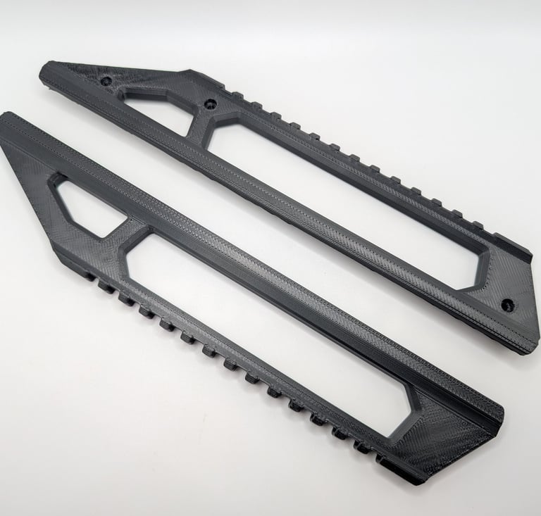 a pair of black plastic pegs on a white background