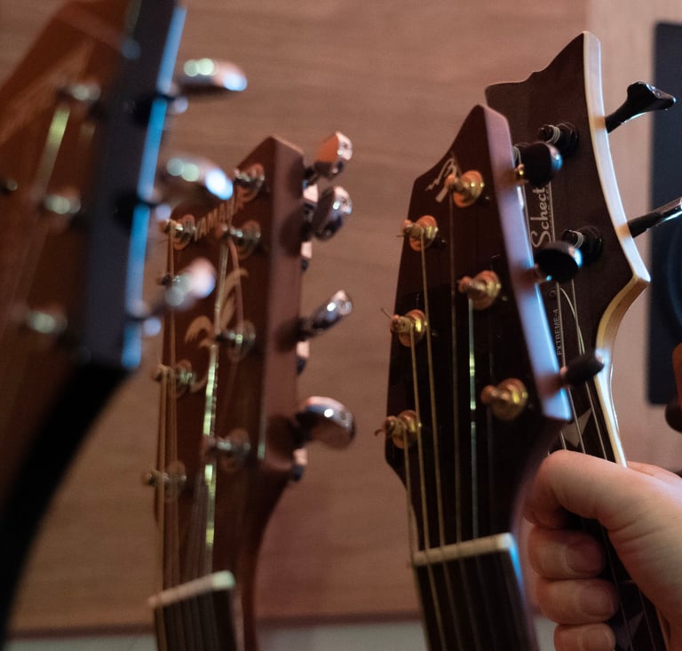 Vox music recording studio guitar headstocks